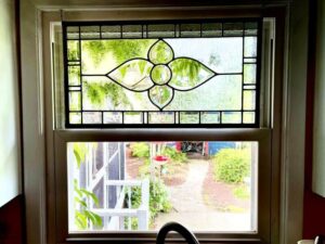 Stained glass beveled panel in kitchen window