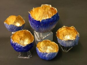 Orbs with blue glaze and gold leaf inside