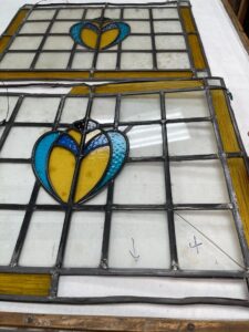 1900s British stained glass panels before restoration