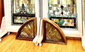 Two finished arched stained glass panels