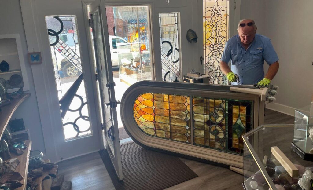 Moving stained glass panel