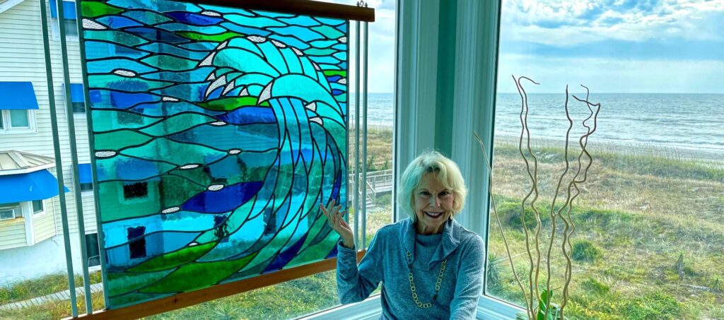 Finished custom stained glass window panel installed at oceanfront home