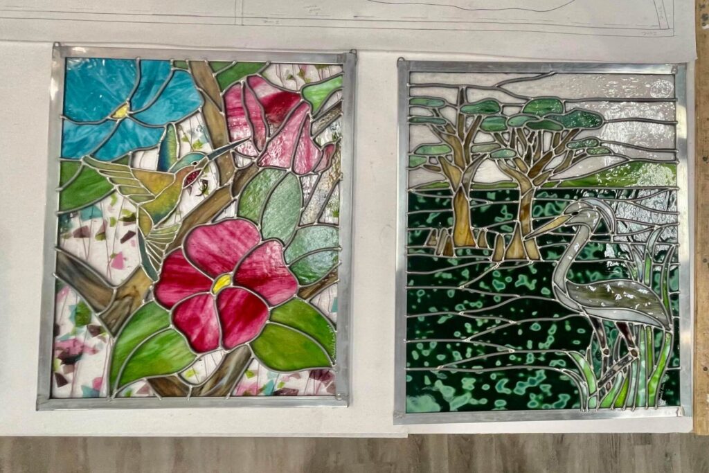 Two colorful stained glass window panels